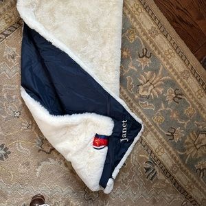 Pretty Rugged lap blanket approx 30x50". White with waterproof navy backing